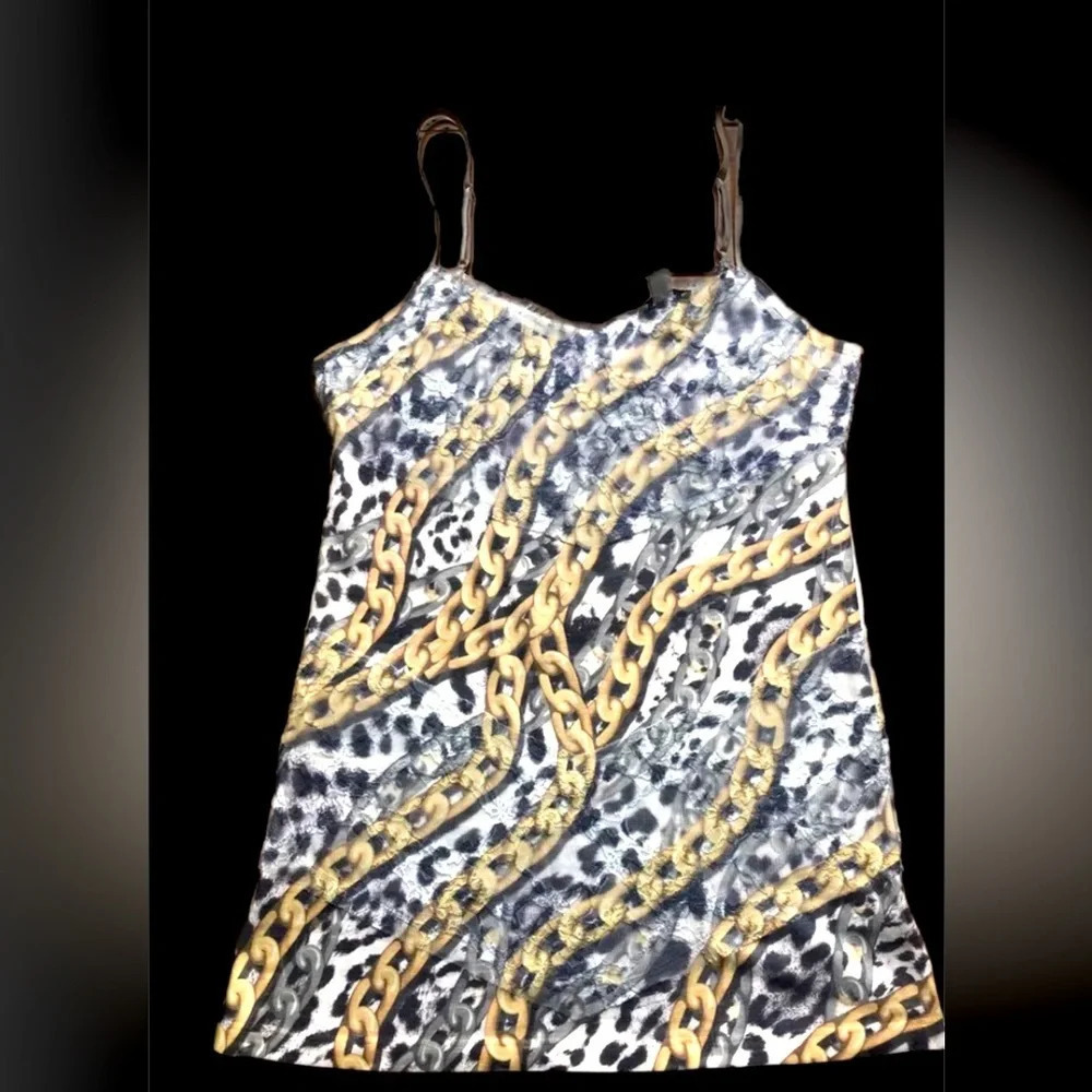 Cache Women's Silver and Gold strap top.
Chain design shirt  -Has lace on top Lg